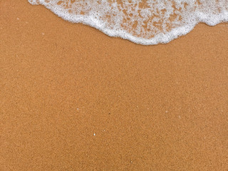 waves on the sand background