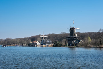 windmills on the shore of kralingse plas in rotterdam, The Netherlands