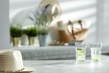 Mineral water in a glass on the table on a beautiful sunny day in the sunshine
