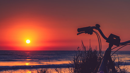 Bicycle on beach, active lifestyle.