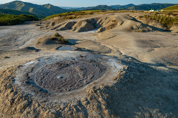 crater of a mud volcano with lava