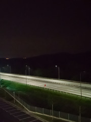 An empty North and South highway at night near the Bandar Seri Putra exit during the Movement Control Order MCO.