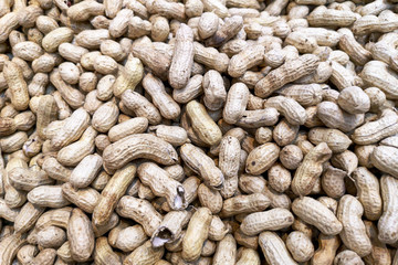 Unpeeled peanuts as background