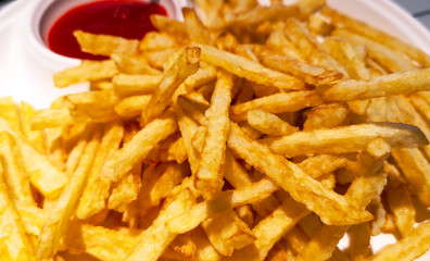 Chips fries on a table in a restaurant.