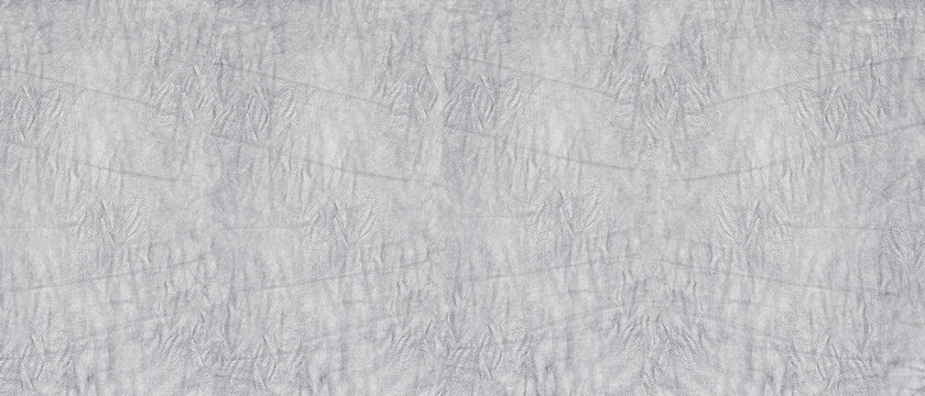 Crumpled silver gray soft leather wide texture. Wrinkled supple leather light background