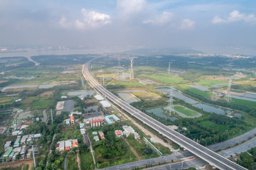 Top view aerial of Long Thanh - Ben Luc expressway. View from  Hiep Phuoc industrial zone. Ho Chi Minh city center, Vietnam with development buildings, transportation, energy power infrastructure