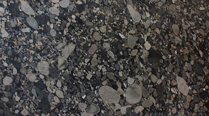 Natural granite with pebbles of black and gray shades of color frozen in it is called Nero Marinace