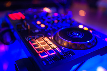 Obraz na płótnie Canvas Remote control for a DJ in a restaurant with a stage.