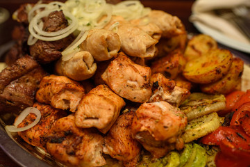 Delicious juicy kebab for guests in the restaurant. A lot of tasty meat.