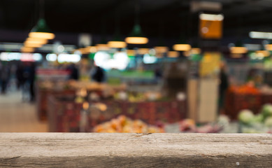 Supermarket background, Counter over blur grocery background, Wooden desk, table, shelf and blur woman shopping at supermarket, Wood counter for grocery store retail product display backdrop, template