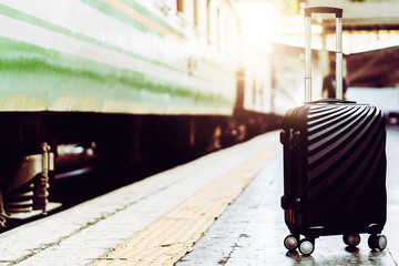 Solo woman backpacker traveler plan safety trip low cost budget summer holiday after coronavirus. Empty tourist on train railway platform. Use bus train sustainable environmental friendly transport