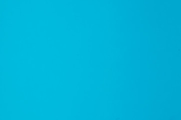 Blurred paper texture in blue, blue background with place for text.