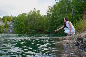 Young woman near lake