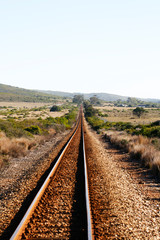 Fototapeta premium Abandoned train tracks travelling into the distance