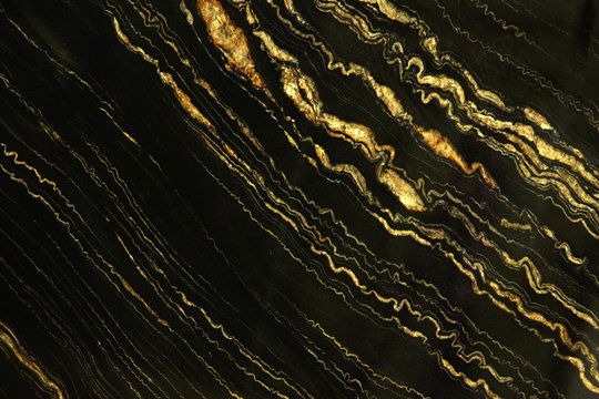 Natural stone black marble with bright yellow stripes called Quarzite Portoro Gold