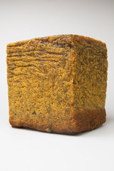 cube synthetic rubber sample on a white background