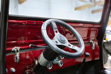Naklejka premium Interior View of Restored 60s Vintage Automobile Dashboard Steering Wheel 