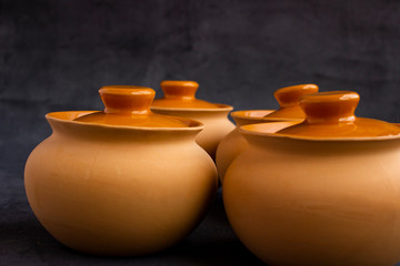 Fototapeta na wymiar clay pots on a wooden table