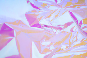 Multicolored background with sparkles and lights. Iridescent holographic abstract soft pastel colors backdrop.
