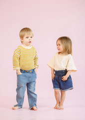 studio portrait of a boy and a girl © zagorodnaya