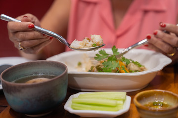 Fried rice with crab meat on spoon.