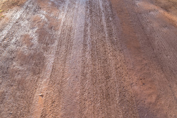 Tyre track on dirt sand or mud.
