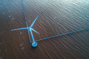 Seacape with Turbine Green Energy Electricity, Windmill for electric power production, Wind turbines generating electricity on the sea at  Bac Lieu, Vietnam. Clean energy concept