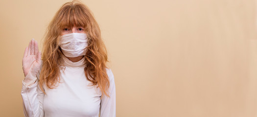 woman with medical mask on face and stop sign with hand, prevention against viruses and infections