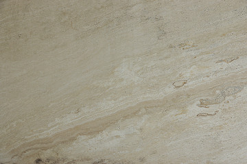 Natural beige stone with parallel stripes called Travertino Alabastrino