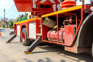Hydraulic equipment of lifting crane with boom and basket for workers © chernikovatv