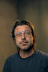 Studio portrait of a man wearing retro eyewear.