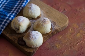 .chocolate filled cookies on colored background with teapot and cup