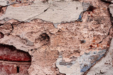 Texture of a concrete wall with cracks and scratches which can be used as a background