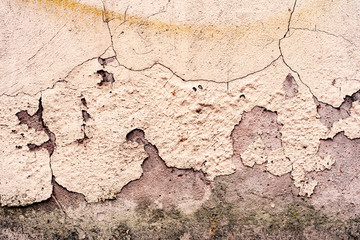 Texture of a concrete wall with cracks and scratches which can be used as a background