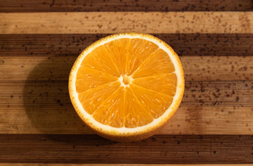 Juicy orange on a wooden board