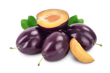 fresh purple plum and half with leaves isolated on white background with clipping path and full depth of field