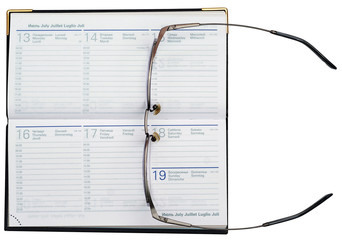 thin-rimmed glasses and organizer