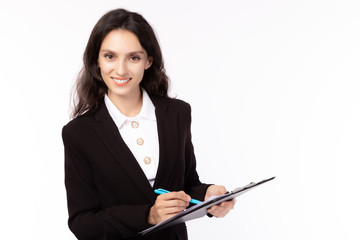Fototapeta na wymiar Smiling attractive mature caucasian businesswoman with lovely smile. Happy businesswomen wearing suit working on document, hold pen, look at camera. Business lady look confident and happy with her job