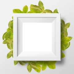 White photo frame with background of green leaves
