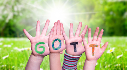 Children Hands Building Colorful German Word Gott Means God. Green Grass Meadow As Background
