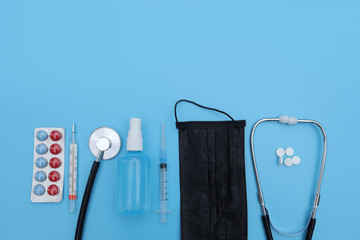 Doctor table with medical items on blue background. Flat lay. medical tools on blue background....