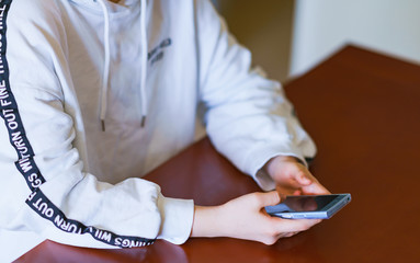 Japanese girl looking smart phone at home