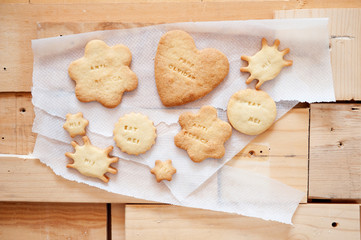 Delicious cookies with message and fun shapes