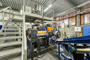 Interior of a factory for manufacturing rubber conveyor belts.