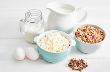 Clean eating healthy cooking ingredients. Food frame. Superfoods concept. Fitness Breakfast.Healthy eating and food, dieting, vegetarian kitchen, Cottage cheese and oatmeal with milk on table