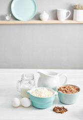 Clean eating healthy cooking ingredients. Food frame. Superfoods concept. Fitness Breakfast.Healthy eating and food, dieting, vegetarian kitchen, Cottage cheese and oatmeal with milk on table