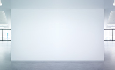 Obraz premium Blank wall in bright office mockup with large windows and sun passing through 3D rendering