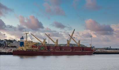 A red tanker at an industrial port in Saint John, New Brunswick, Canada