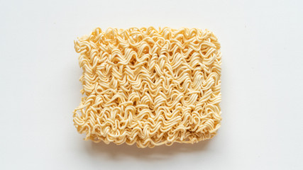 Raw egg noodles isolated on white background.