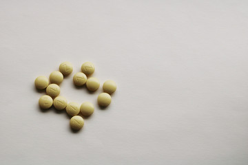 yellow tablets on a white background